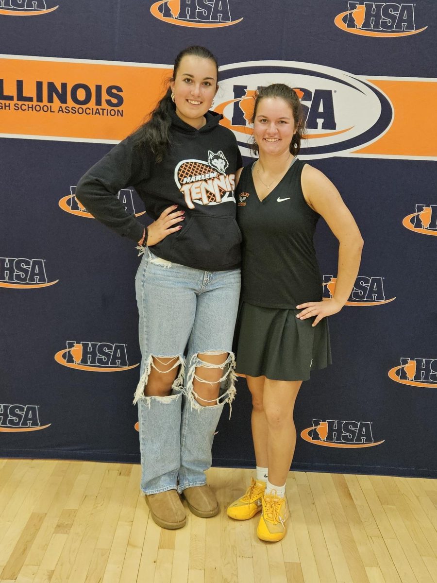 From Left to right, Ana Besevic (11), and Melina Coletta (11), pose at the Illinois State Girls Tennis Conference at Hersey High School.