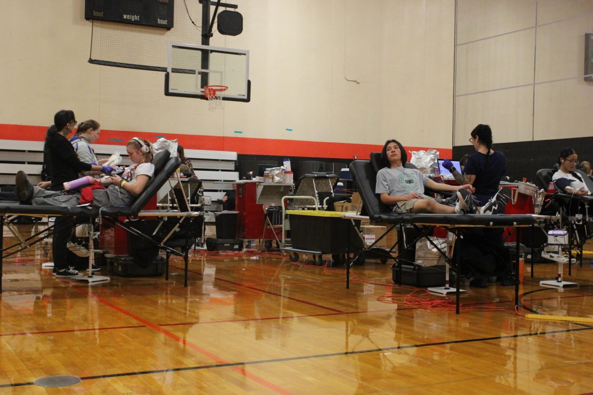 James Gallagher (12) begins the process of giving blood.
